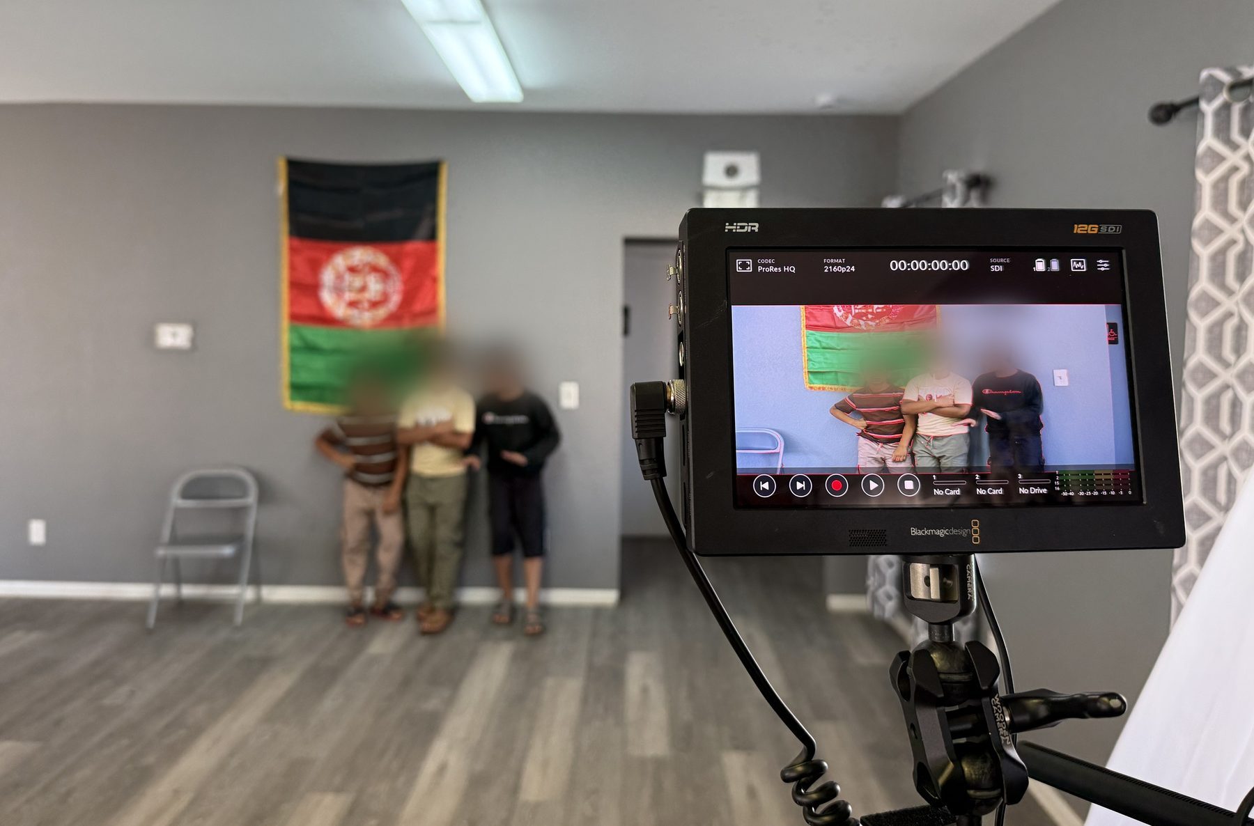 A production monitor showing the live camera feed during an interview setup